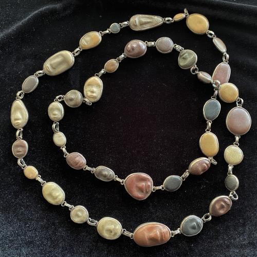 40" Sterling Silver Necklace with 27 Hand Carved Stone Faces by Mary Nohl